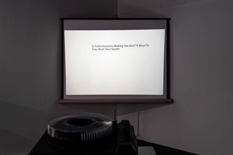© Nina White - Installation view of slide projector and constructed slides in "[are you] Projecting "