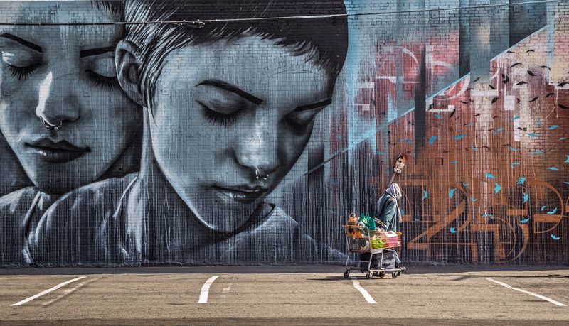© Nikolay Epifanov - Attention. It appears only the painted girl and nobody else cares about this homeless man. Los-Angeles Downtown, 2017.