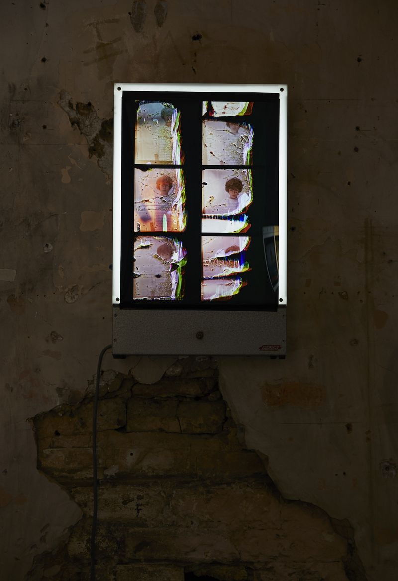© Rhiannon Adam - Installation shot. View of Duratrans contact sheet of Noah's film roll displayed on reclaimed hospital x-ray viewer