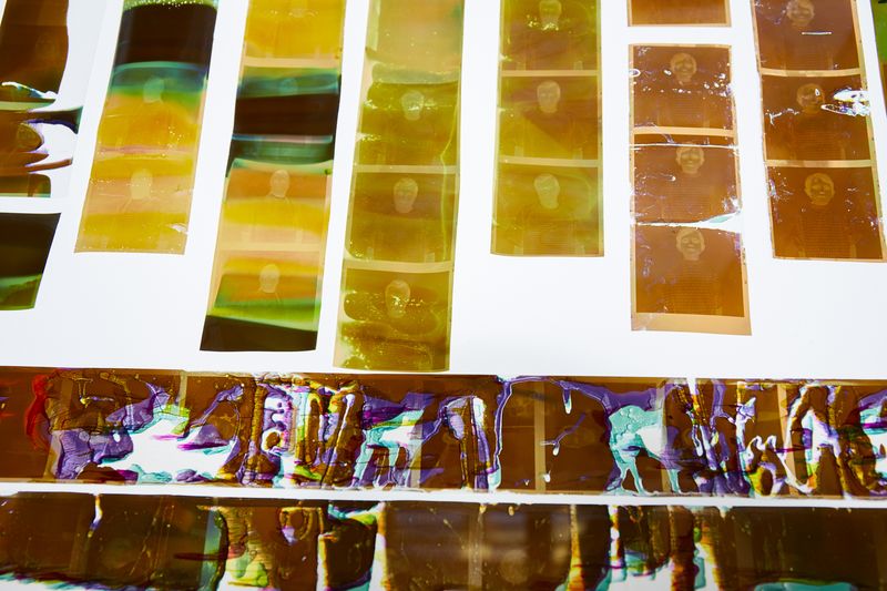 © Rhiannon Adam - Installation shot. The film itself, as damaged by the samples, displayed on a lightbox.