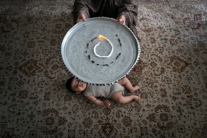 © sima choubdarzadeh - They set on fire the fear. it is a tradition custom to fight with fear.