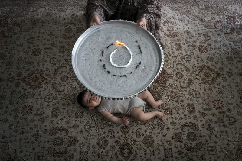 © sima choubdarzadeh - They set on fire the fear. it is a tradition custom to fight with fear.