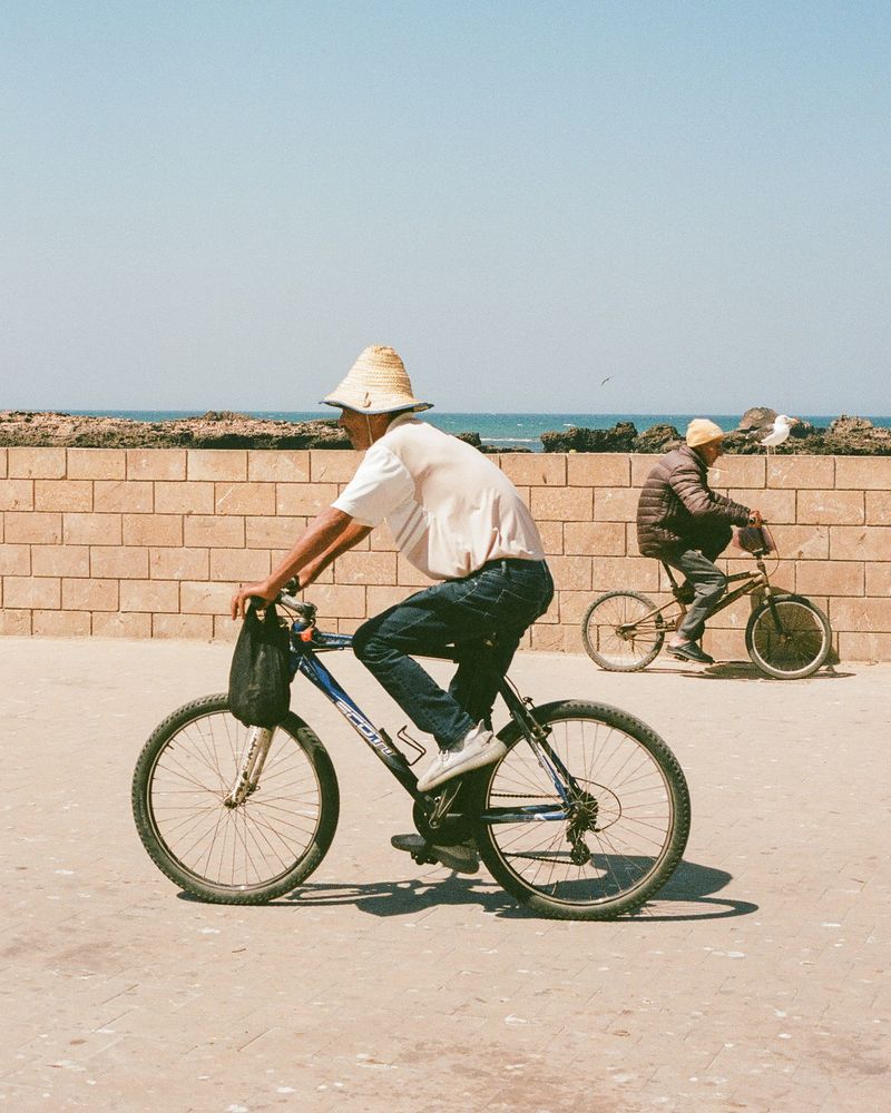 © Annissa Durar - Bikers commuting along the promenade in Essaouira