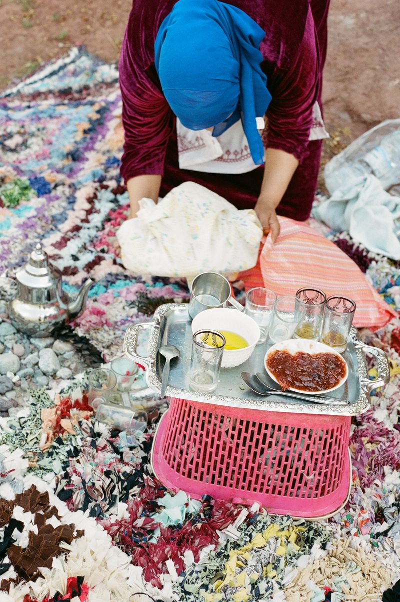 © Annissa Durar - Tea time spread with jam, olive oil, and bread