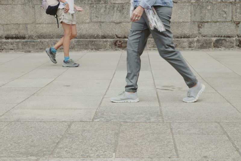 © Ana Norman Bermudez - Pilgrims and locals cross paths in Santiago de Compostela's streets.