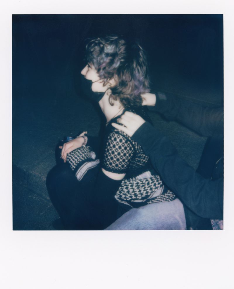 © Shirin Abedi - A protester massages the neck of another protester during May Day 2025 in Berlin.