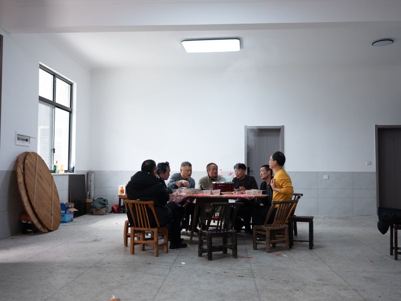 © Shina Peng - Dad (in yellow) and his cousins chatting after lunch.