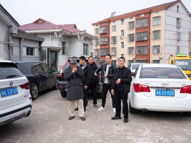 © Shina Peng - Uncles having a smoke break outside of the Peng ancestral temple.