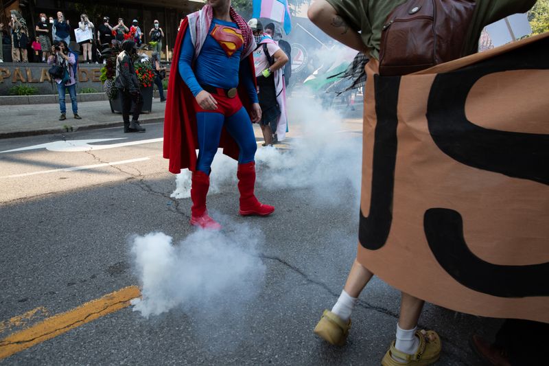SPVM tear gassing demonstrators.