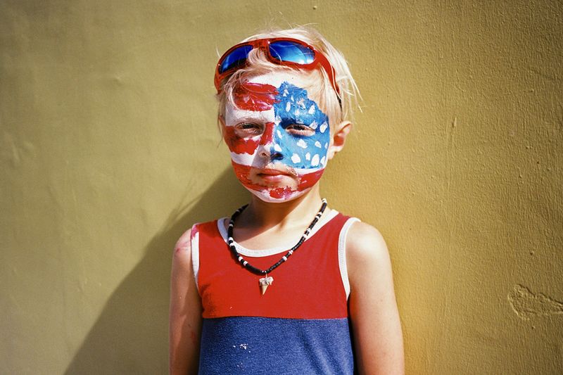 © Rachel Fleischman - Young American on vacation with his parents and sister on the Fourth of July on St. George Street. (2025)