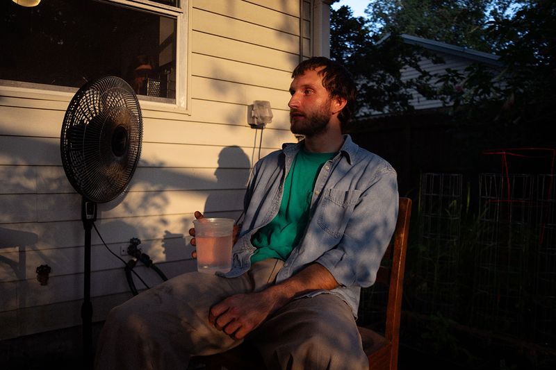 © Rachel Fleischman - Matt, the roaster of one of St. Augustine's most popular coffee shops, in his overgrown yard. (2025)