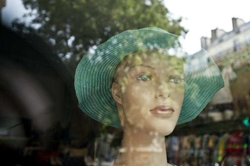 © Steven Edson - Store mannequins in window in Paris, France