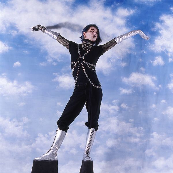 © Steven Edson - Young man dressed in Goth clothing wearing very high platform shoes