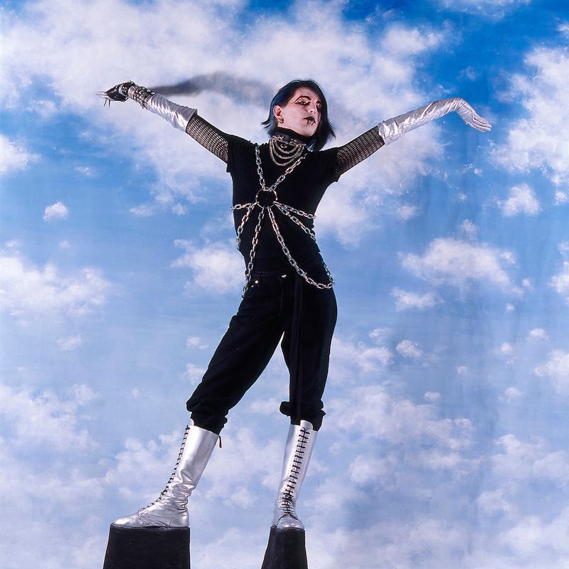 © Steven Edson - Young man dressed in Goth clothing wearing very high platform shoes