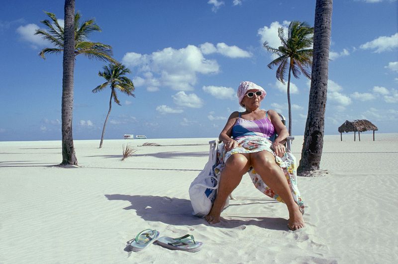 © Steven Edson - Old lady sitting on South Beach, Miami, FL