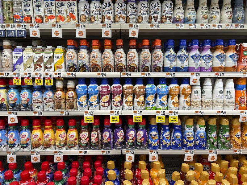 © Steven Edson - Bottles of alternative milk and creams.