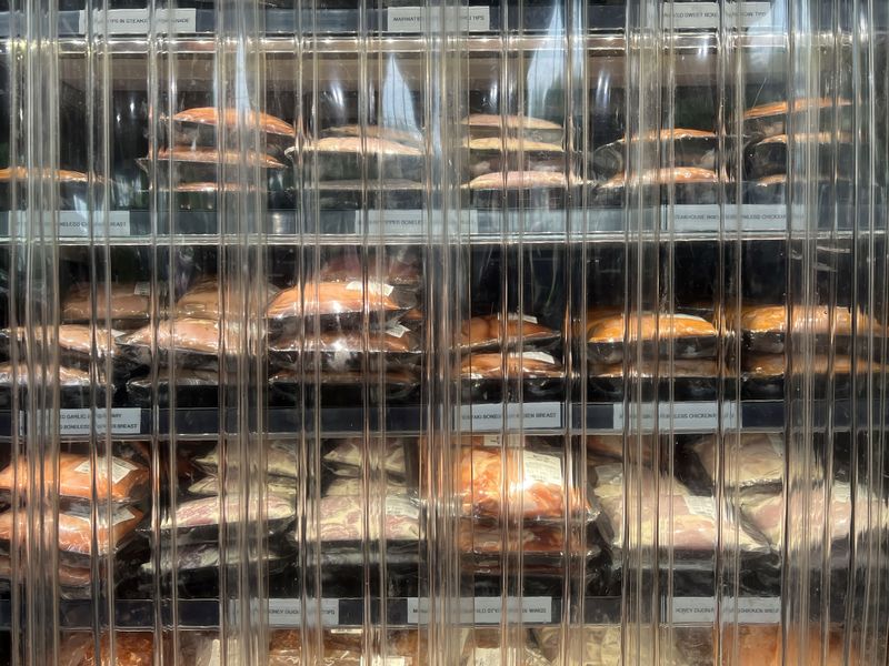 © Steven Edson - Prepared foods packaged and ready for sale in a refrigerated cold case.