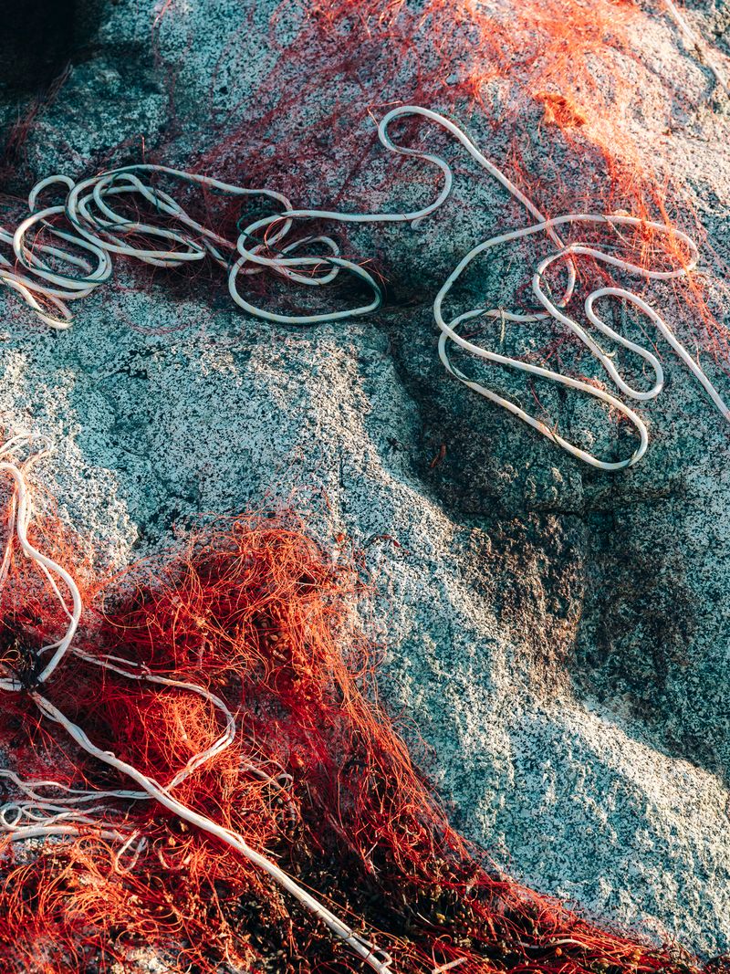 © Jan Richard Heinicke - Fishing nets drying in the harbor of Narsaq.