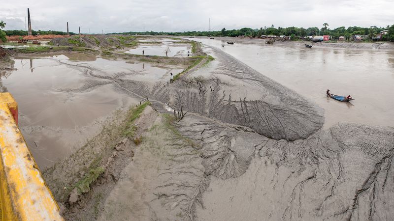 © Carrie and Eric Tomberlin - Low Tide Along Harihar River, Chuknagar