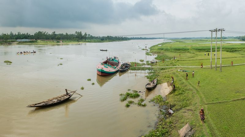 © Carrie and Eric Tomberlin - Pumping Dredged Silt, Bangali River, Sirajganj