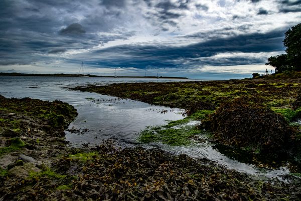 © Cody Ryan Tippie - Inward Haven; sailboats pass of a cove nestled to that of an Eagle's roost.