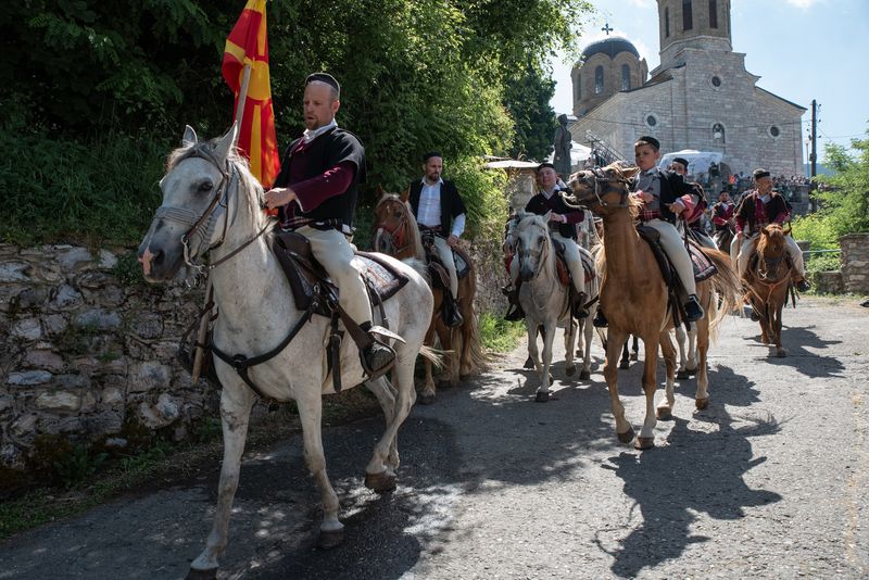 © Biljana Jurukovski - The grooms entourage on the horses going to the brides house.