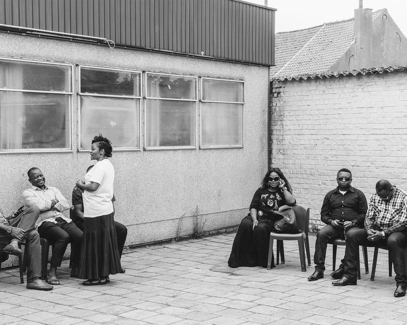 © Rebecca  Fertinel - After the funeral, family members from across the world gathers around.