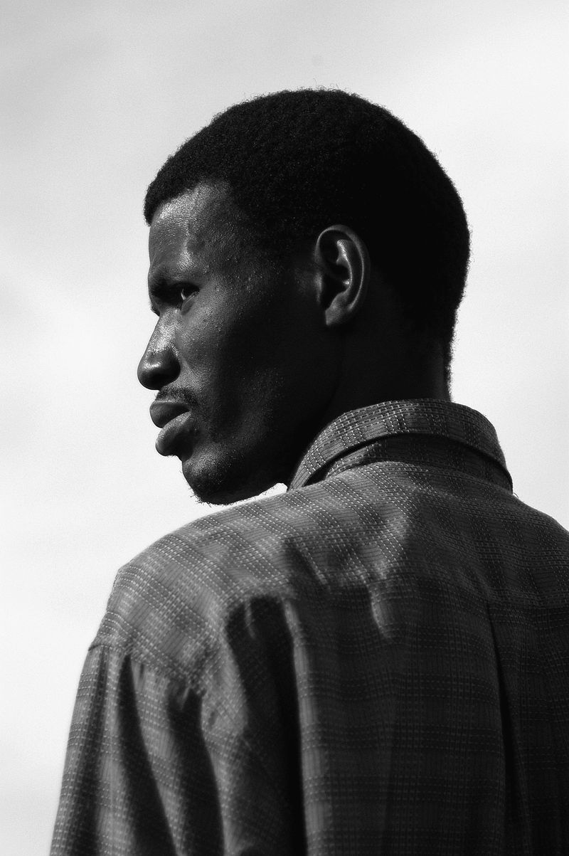 © John Perivolaris - African Migrant, Retamar, Almería, Spain, 2004.