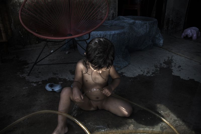 © Yael Martínez - The batherItzel Martinez (my daughter) taking a bath at home. Guerrero Mexico