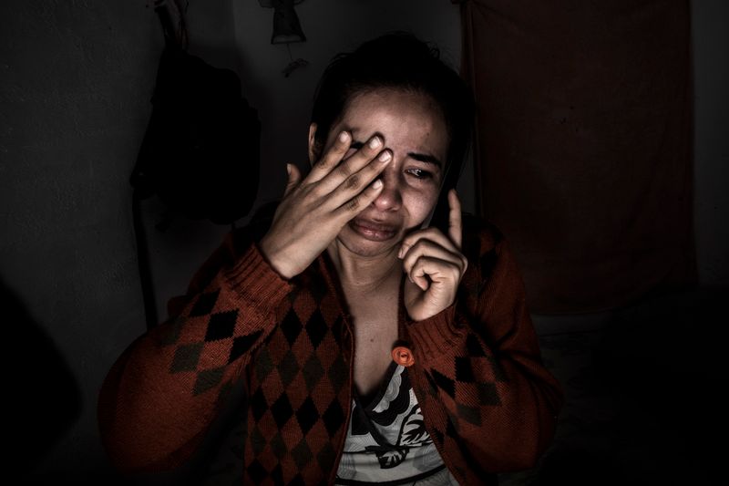 © Yael Martínez - The callLucero Granda taking the call where her mother tell her that her brother was killed, at Iguala Guerrero