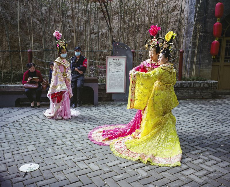 © Pan Wang - Three women in Tang Dynasty costumes are in qujiangchi ruins park