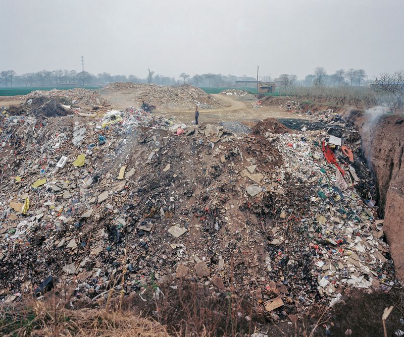 © Pan Wang - 20.The soil is refilled as construction waste into large pits dug by the brick factory