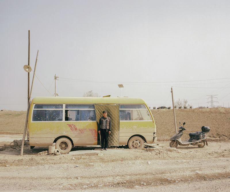 © Pan Wang - 19.After scrapping the abandoned bus, it was placed at the mouth of the Wei River and became a workstation for inspectors