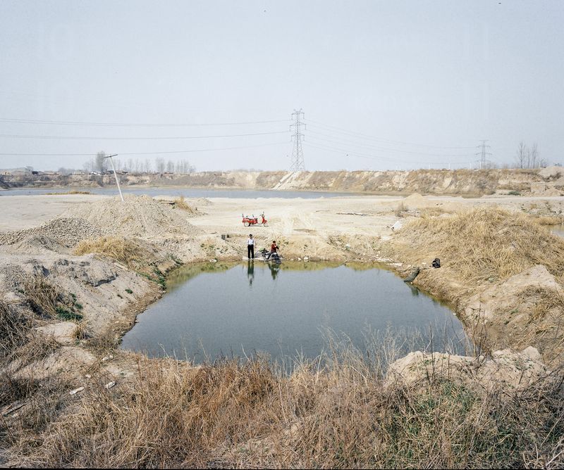 © Pan Wang - 17. Retired worker fishing in the river and his child