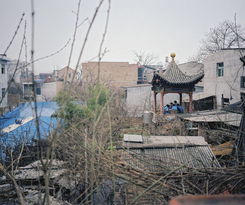 © Pan Wang - 15. Students playing mahjong in the pavilion during lunchtime