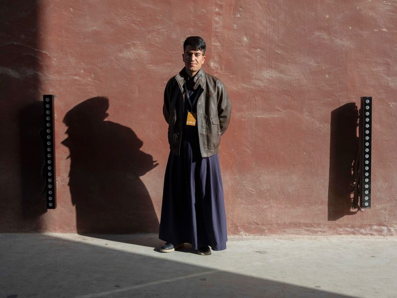 © Pan Wang - staff members.at the entrance of Yotkan Ancient City, Xinjiang Uygur Autonomous Region,China,October 25, 2025.