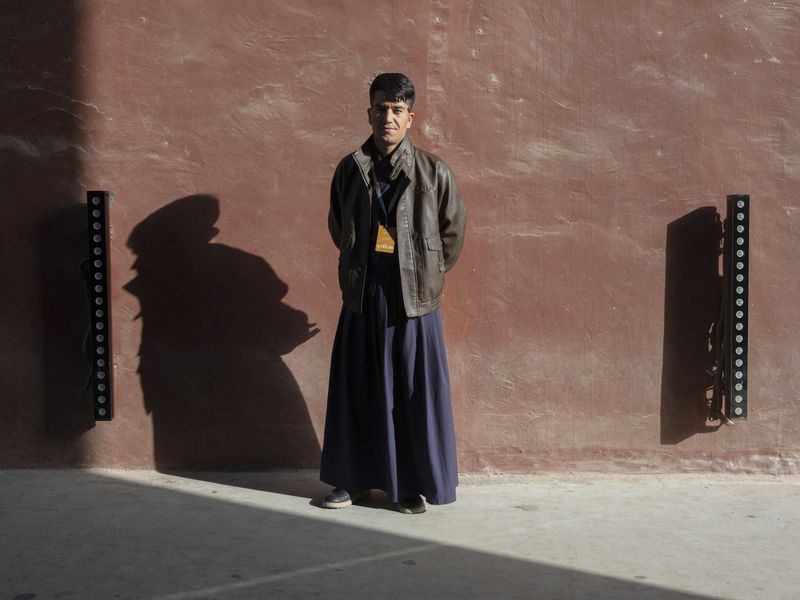 © Pan Wang - staff members.at the entrance of Yotkan Ancient City, Xinjiang Uygur Autonomous Region,China,October 25, 2025.