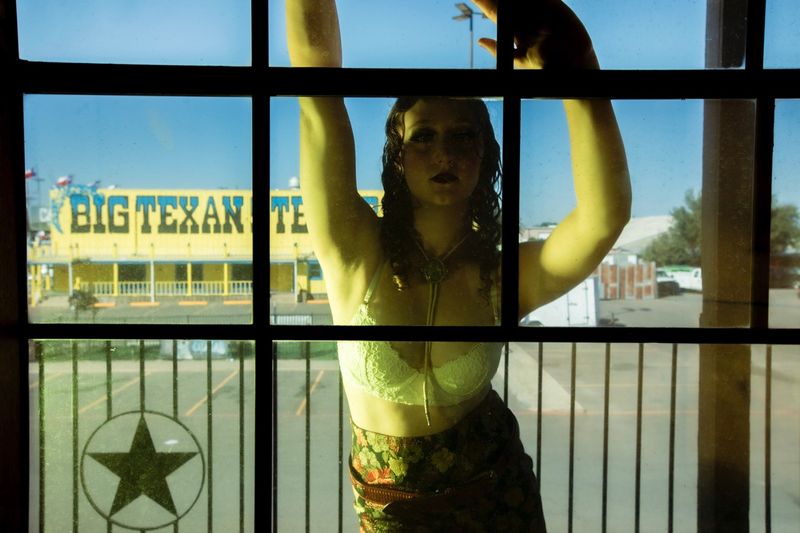 © William Hohe - Charlotte peers into our hotel room, Amarillo, TX.