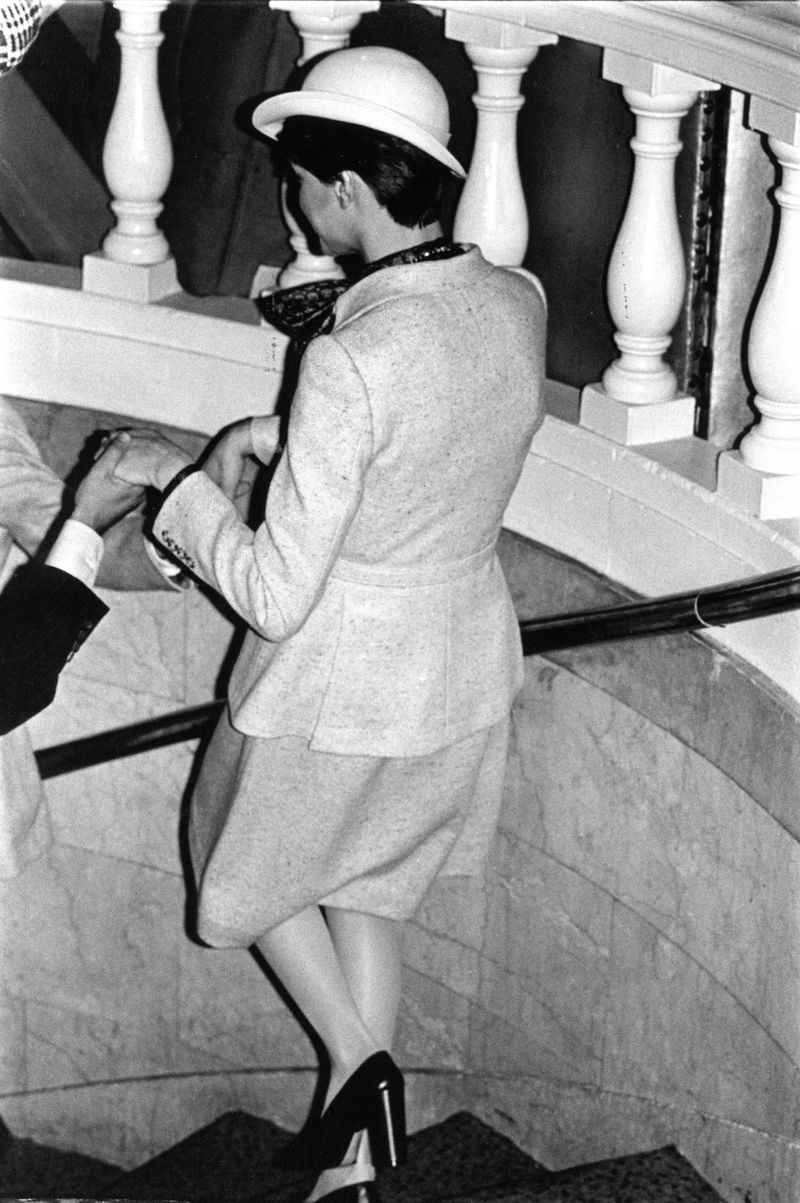 © Diana Mara Henry - Model with two helpers going down stairs to the runway, Fashion Week at the Plaza.