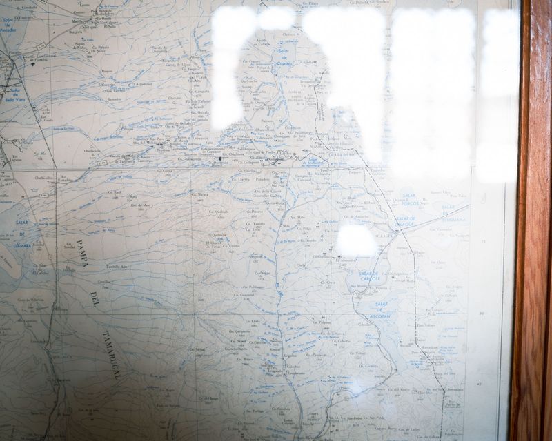 © Fernanda Soto Mastrantonio - Self-portrait facing the unknown, the map as a symbol of the identity and the journey.