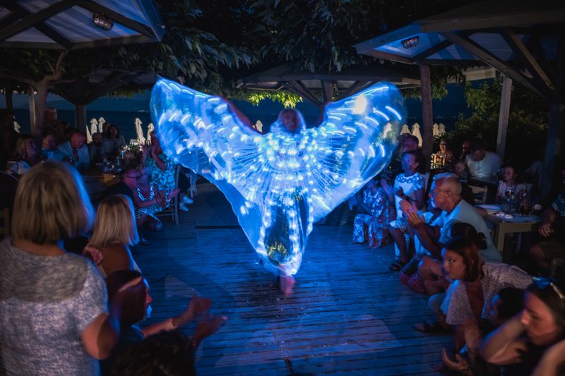 © Christopher Jones - Neon cape performerSidari, Corfu.A performer wears a lighted costume during a nightclub show.