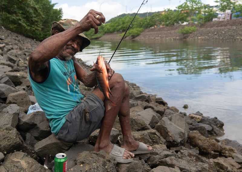 © Tova Katzman - Brown holds up the Mangrove Snapper he caught in the Canal, 2021