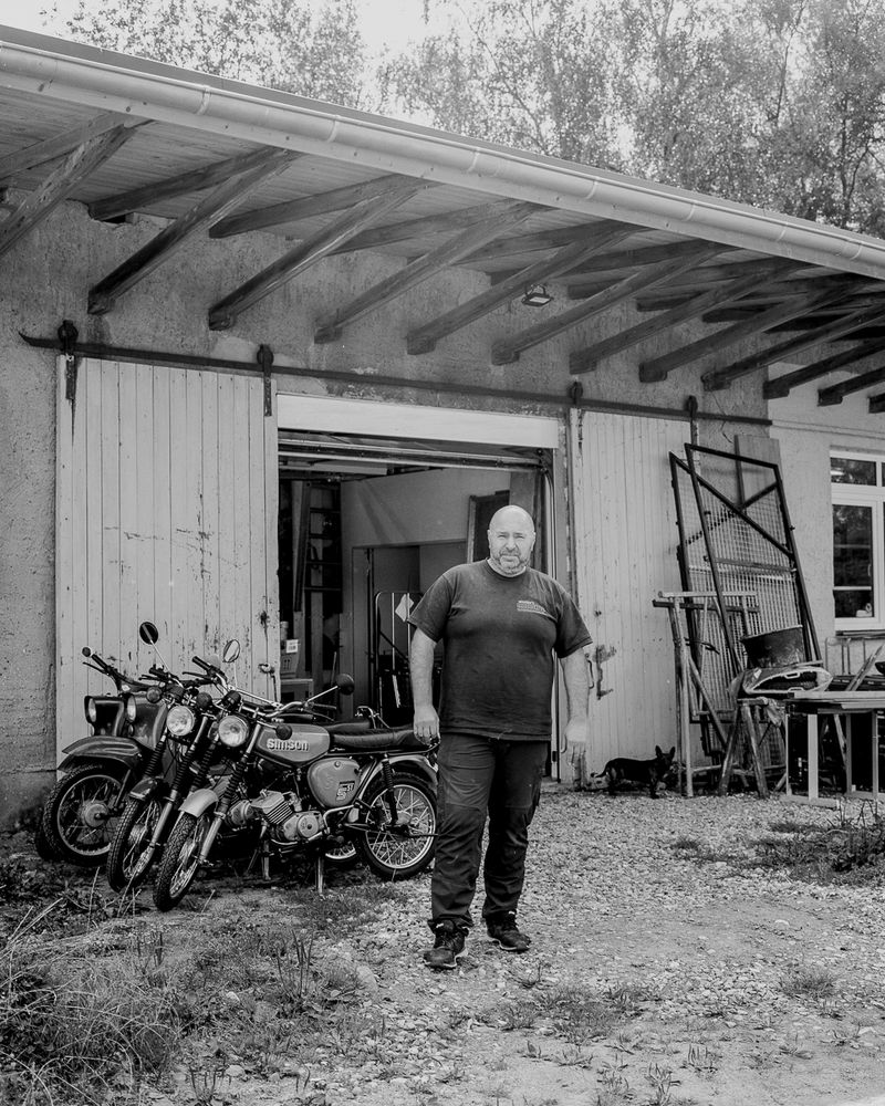 © Paweł Starzec - Thomas, owner of a motorcycle and moped workshop located next to former internal border.