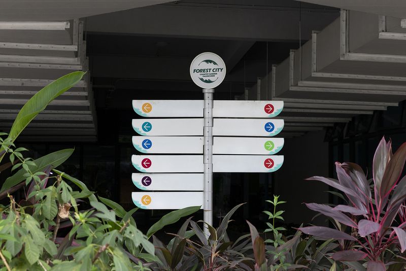 © Francesca Pompei - A road signal  without any indication outside a car park.