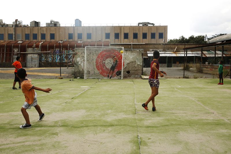© Francesca Pompei - A soccer field inside Metropoliz, the former Fiorucci delicatessen  factory in the Prenestino district