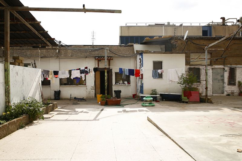 © Francesca Pompei - The courtyard of an inhabitant of Metropoliz, the former Fiorucci delicatessen  factory in the Prenestino district
