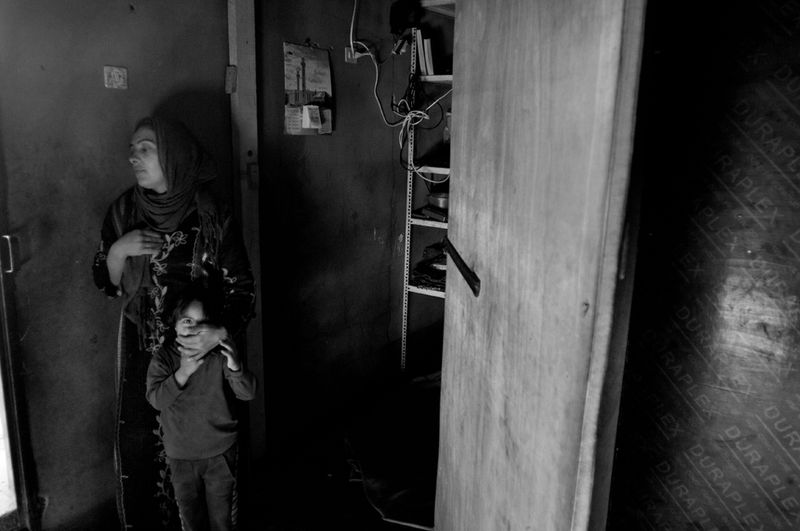 © Stephen Boyle - Syrians who fled the civil war living in a shed, rented from Lebanese. Jeb Jennine, Baqaa Valley, Lebanon Febuary 2014