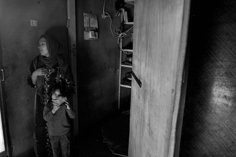 © Stephen Boyle - Syrians who fled the civil war living in a shed, rented from Lebanese. Jeb Jennine, Baqaa Valley, Lebanon Febuary 2014