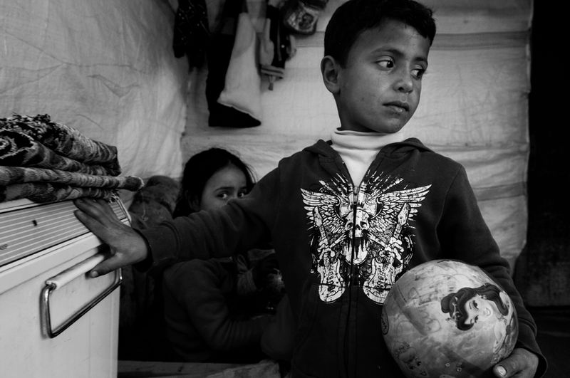 © Stephen Boyle - Young Syrian refugees in their tent. Jeb Jennine, Baqaa Valley, Lebanon. February 2014.