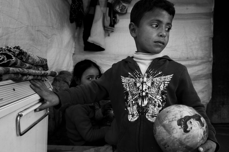 © Stephen Boyle - Young Syrian refugees in their tent. Jeb Jennine, Baqaa Valley, Lebanon. February 2014.